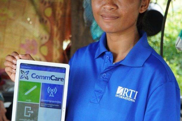 Community health worker using a CommCare job aid in Cambodia's Integrated Early Childhood Development Activity