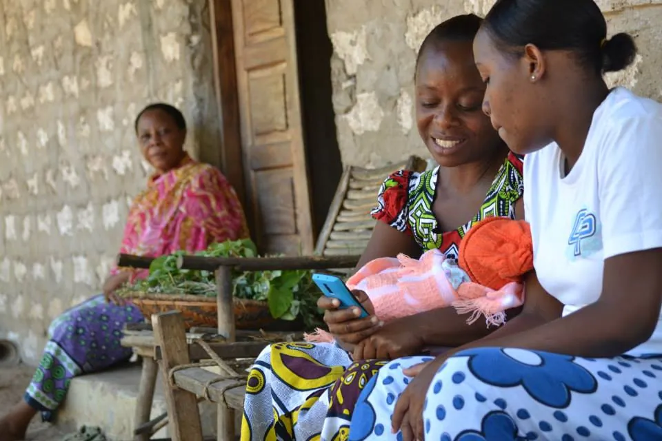 Research coordinator with patient in Nairobi