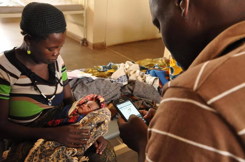 Healthcare worker with patient, Africa