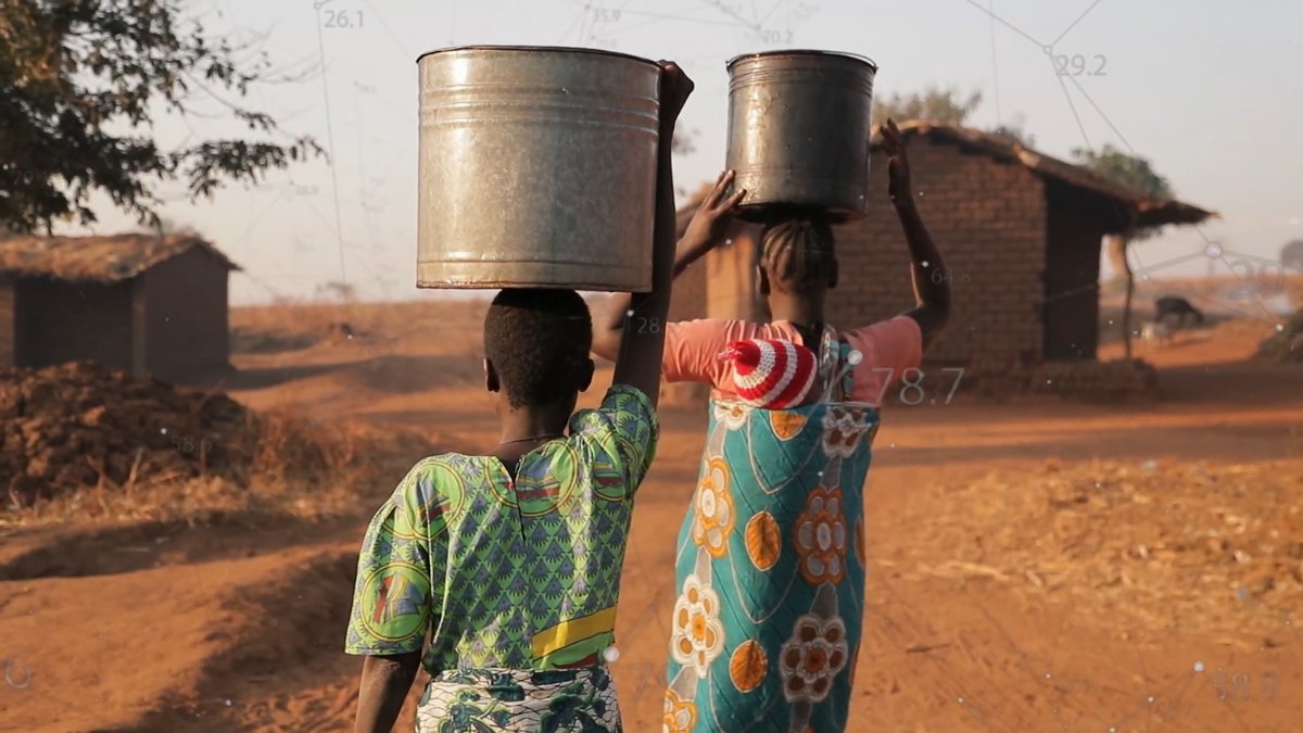 Two children carrying water home, a still from the IRC's CommCare impact video
