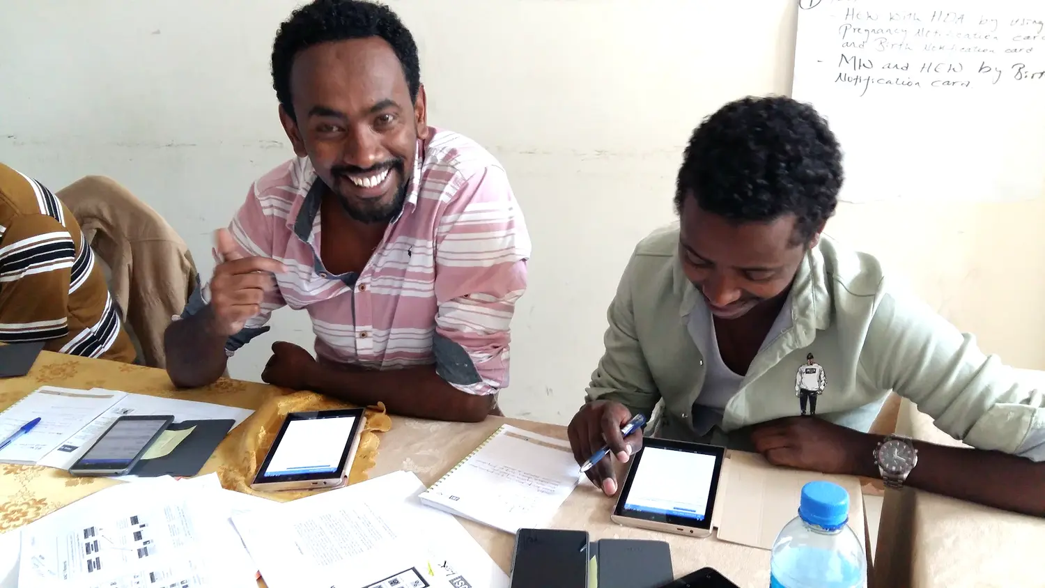 Health extension workers in Ethiopia training on eCHIS tablets