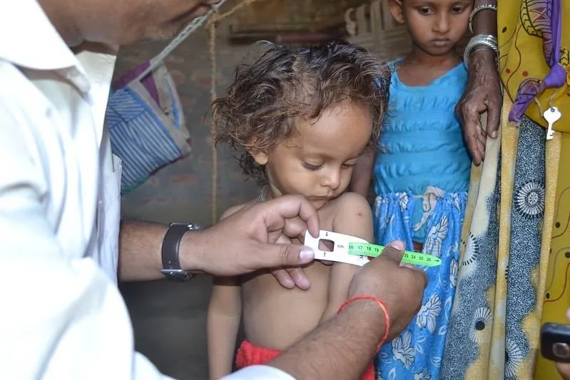 Child receiving care during a health campaign, CommCare recognized in UNICEF Digital Tool Selection Guidebook