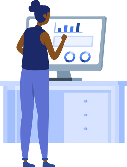 An analyst reviewing dashboards and charts on a desktop computer
