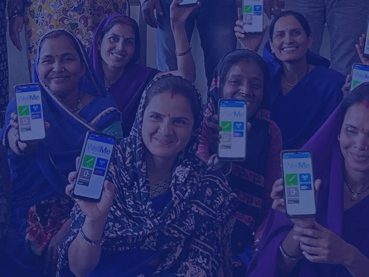 Frontline Workers holding phones running the WellMe application